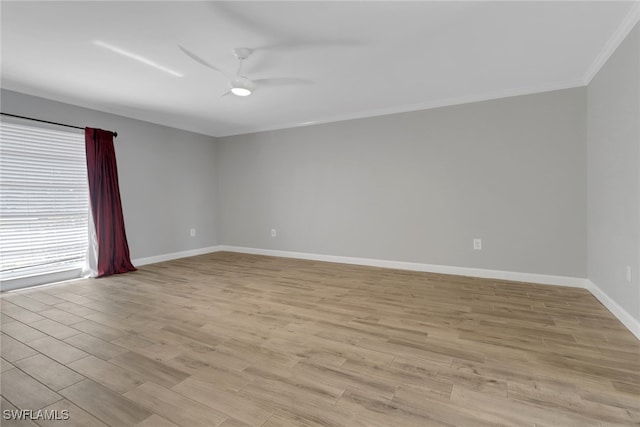 empty room with crown molding, a ceiling fan, baseboards, and light wood finished floors