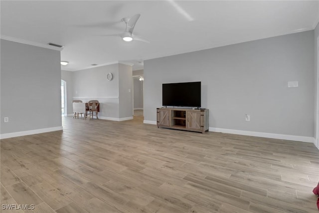 unfurnished living room with crown molding, ceiling fan, and light hardwood / wood-style flooring