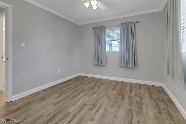 spare room with crown molding, ceiling fan, and light hardwood / wood-style floors