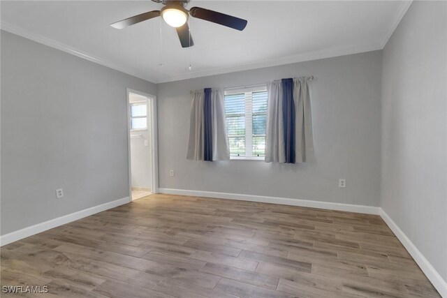 unfurnished room featuring ornamental molding, ceiling fan, and light hardwood / wood-style flooring