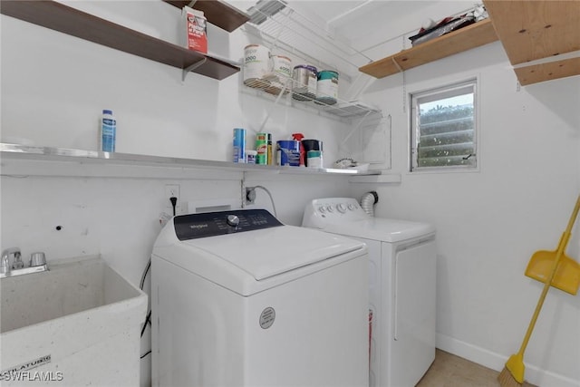 washroom featuring sink and washer and clothes dryer