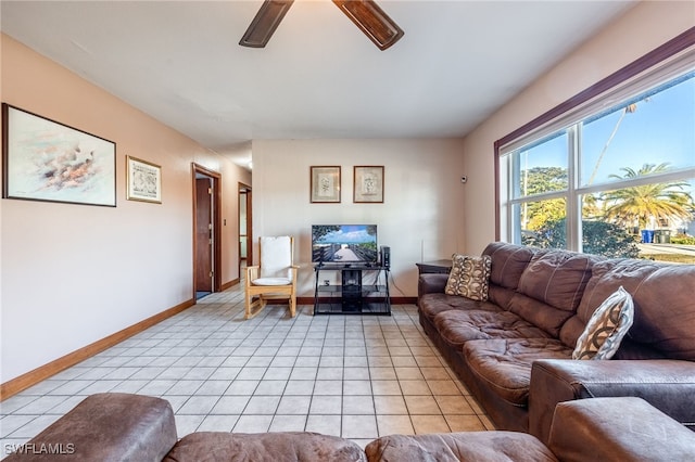 living room with light tile patterned floors and ceiling fan