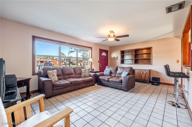 living room with light tile patterned flooring and ceiling fan