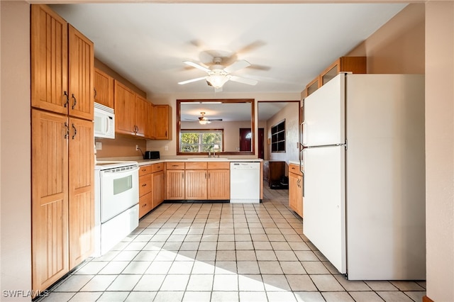 kitchen with sink, white appliances, ceiling fan, and light tile patterned flooring