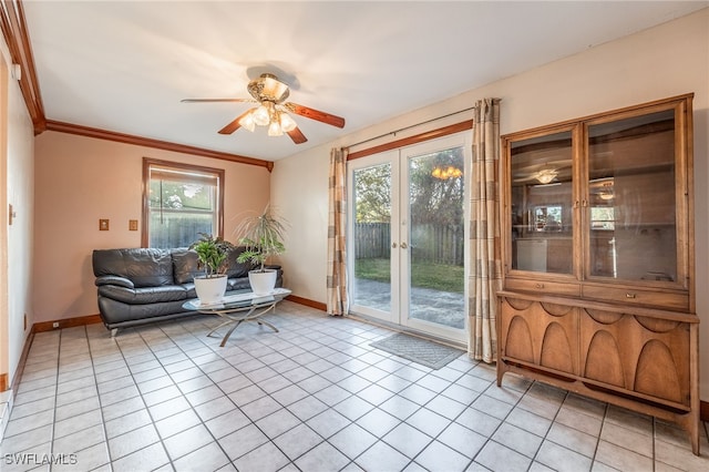 interior space featuring ornamental molding, light tile patterned floors, and ceiling fan