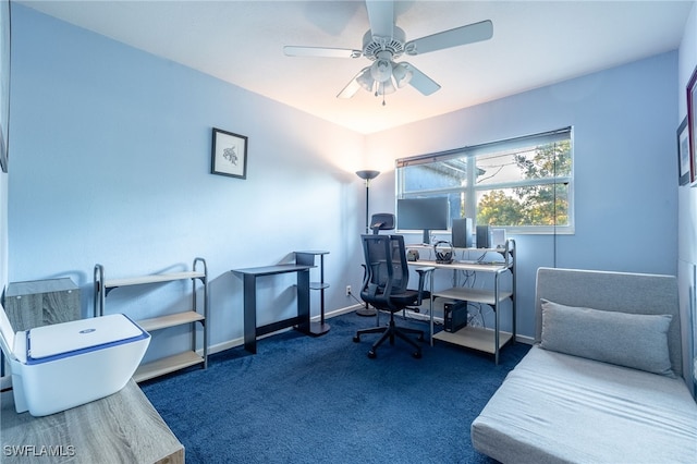 office area with dark carpet and ceiling fan