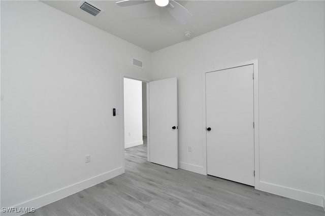 unfurnished bedroom featuring ceiling fan and light hardwood / wood-style floors