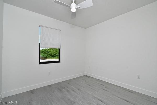 unfurnished room with light hardwood / wood-style floors and ceiling fan