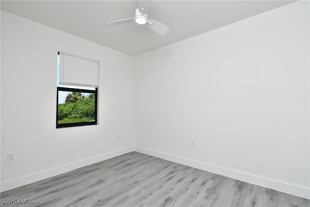 empty room with light hardwood / wood-style floors and ceiling fan