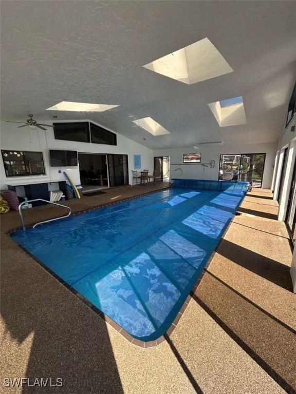 view of pool featuring a skylight