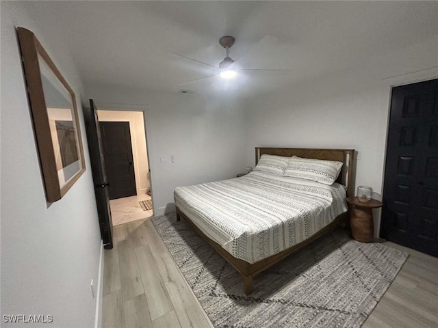 bedroom with light hardwood / wood-style floors and ceiling fan