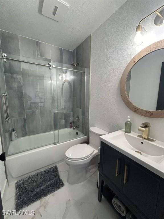 full bathroom featuring toilet, vanity, shower / bath combination with glass door, and a textured ceiling