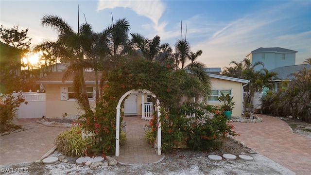 view of property hidden behind natural elements