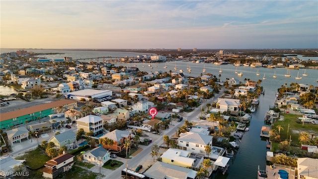 aerial view at dusk with a water view