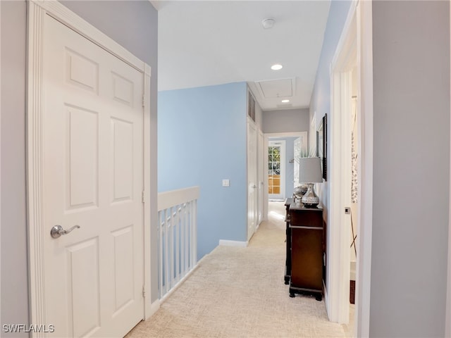 hallway with light carpet