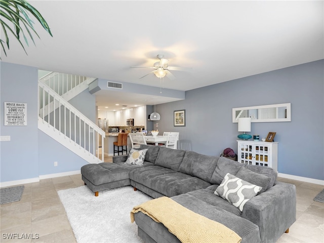 living room featuring ceiling fan