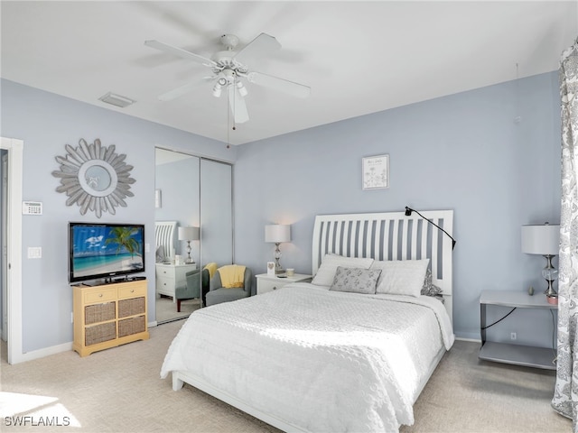 bedroom featuring carpet flooring, ceiling fan, and a closet