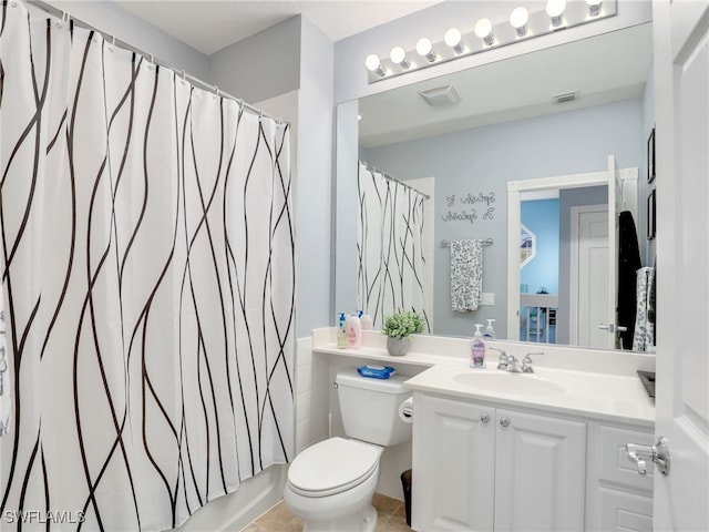 full bathroom featuring vanity, toilet, and shower / bath combo with shower curtain