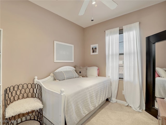 carpeted bedroom featuring ceiling fan