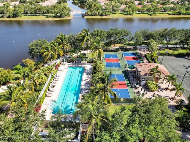 birds eye view of property with a water view