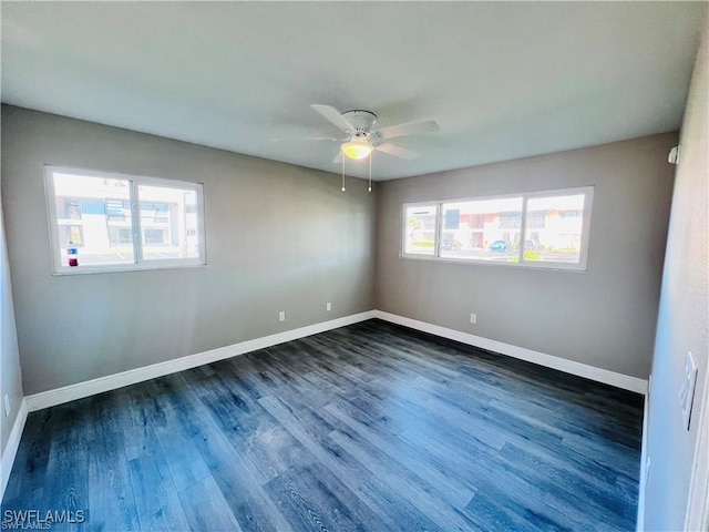 empty room featuring dark hardwood / wood-style floors and ceiling fan