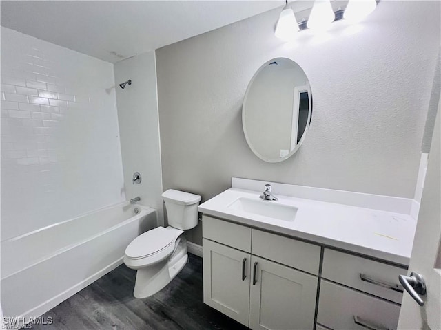 full bathroom with vanity, toilet, tiled shower / bath combo, and hardwood / wood-style floors