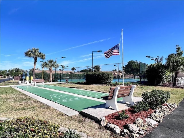 view of community with tennis court