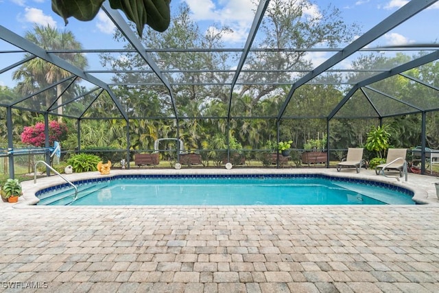 view of swimming pool with a patio and glass enclosure