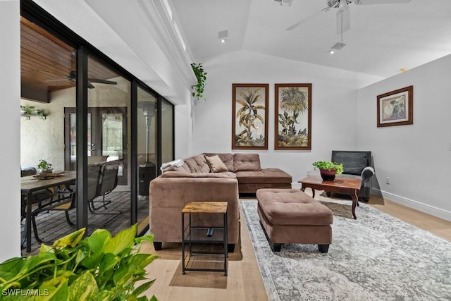 living room with lofted ceiling, light hardwood / wood-style floors, and ceiling fan