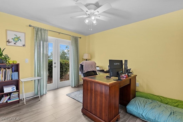 office with french doors, ceiling fan, and hardwood / wood-style flooring