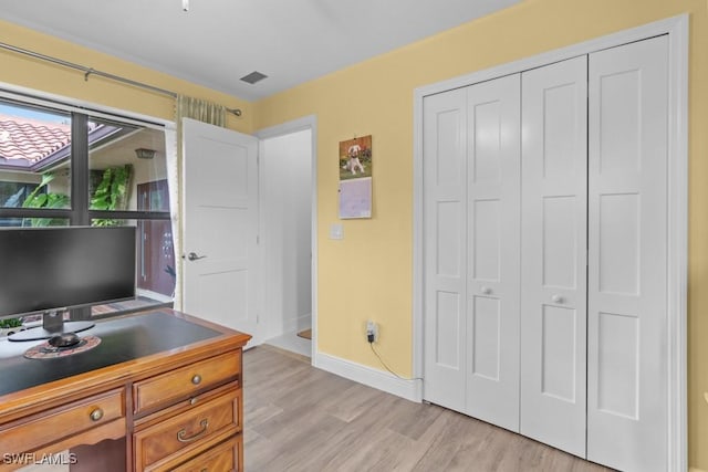 office space with light hardwood / wood-style floors