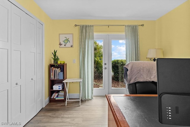 doorway featuring light hardwood / wood-style floors and french doors