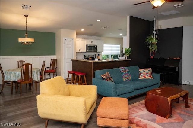 4176 Madison St, Ave Maria, FL 34142 - living area with ceiling fan, a wainscoted wall, wood finished floors, and recessed lighting