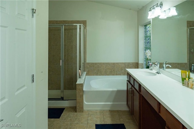 4176 Madison St, Ave Maria, FL 34142 - full bathroom featuring tile patterned flooring, a stall shower, a bath, and vanity