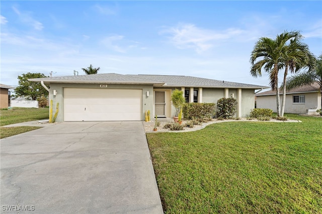 single story home featuring a garage and a front lawn