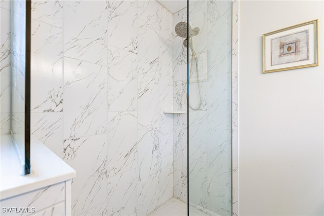 bathroom with a tile shower