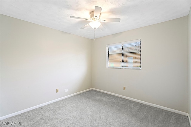 empty room featuring ceiling fan and carpet flooring