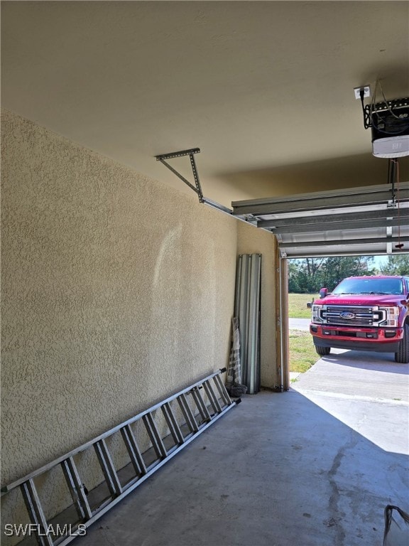 garage featuring a garage door opener