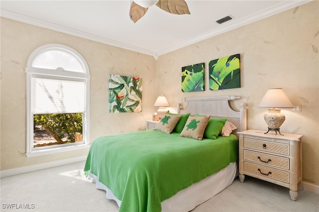 bedroom featuring crown molding and light carpet