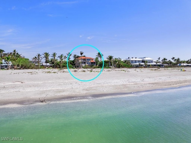 drone / aerial view with a view of the beach and a water view