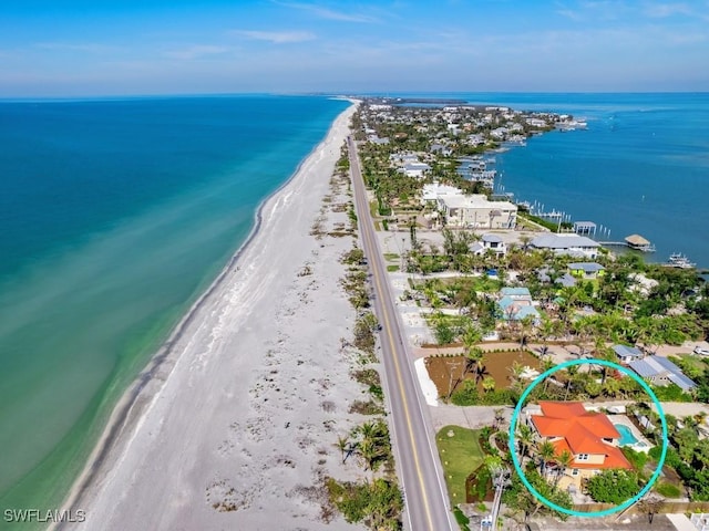 bird's eye view featuring a beach view and a water view