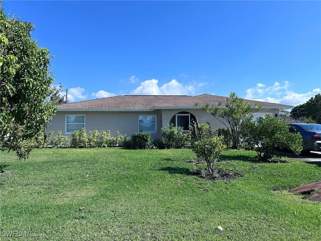 single story home with a front yard