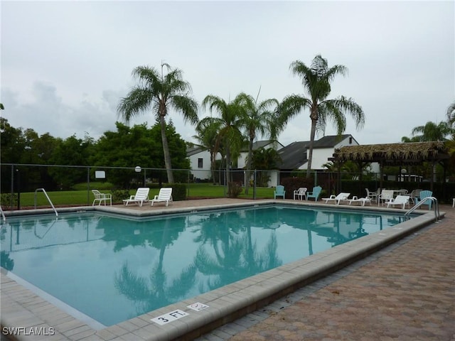 view of swimming pool with a patio area