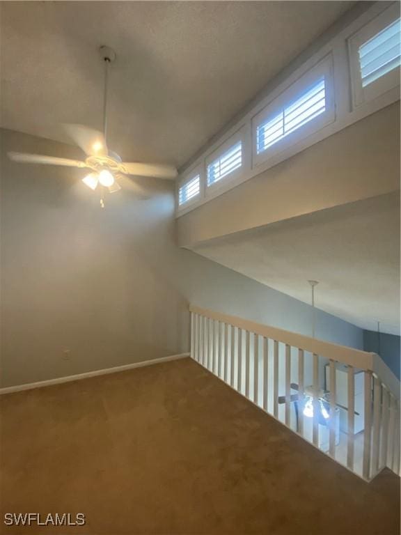 interior space featuring ceiling fan and carpet flooring