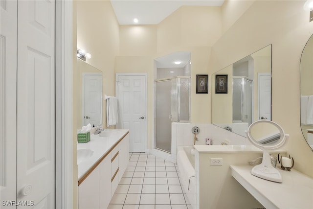 bathroom with plus walk in shower, tile patterned floors, and vanity