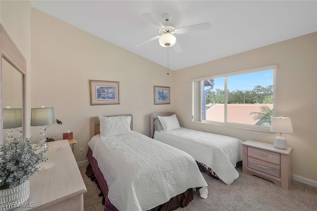 bedroom featuring lofted ceiling, light carpet, and ceiling fan