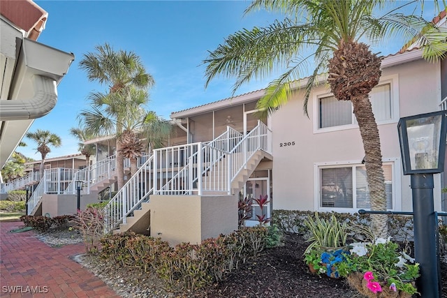 view of front of property featuring a sunroom