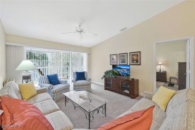 living room featuring lofted ceiling, light carpet, and ceiling fan