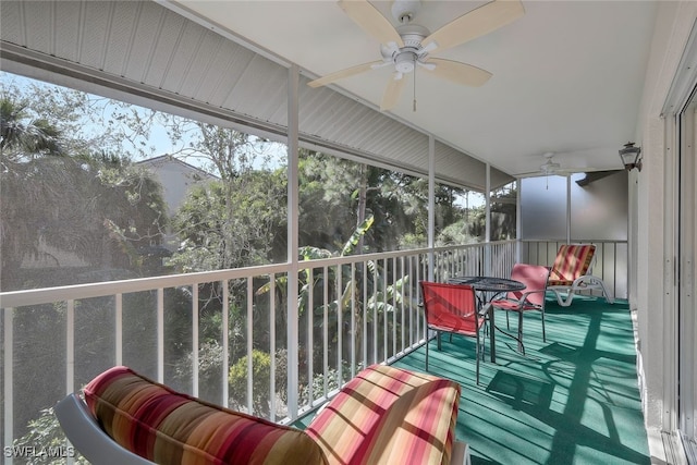 sunroom / solarium featuring plenty of natural light and ceiling fan