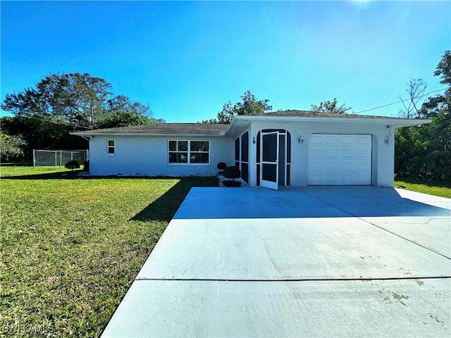 ranch-style house with a garage and a front yard